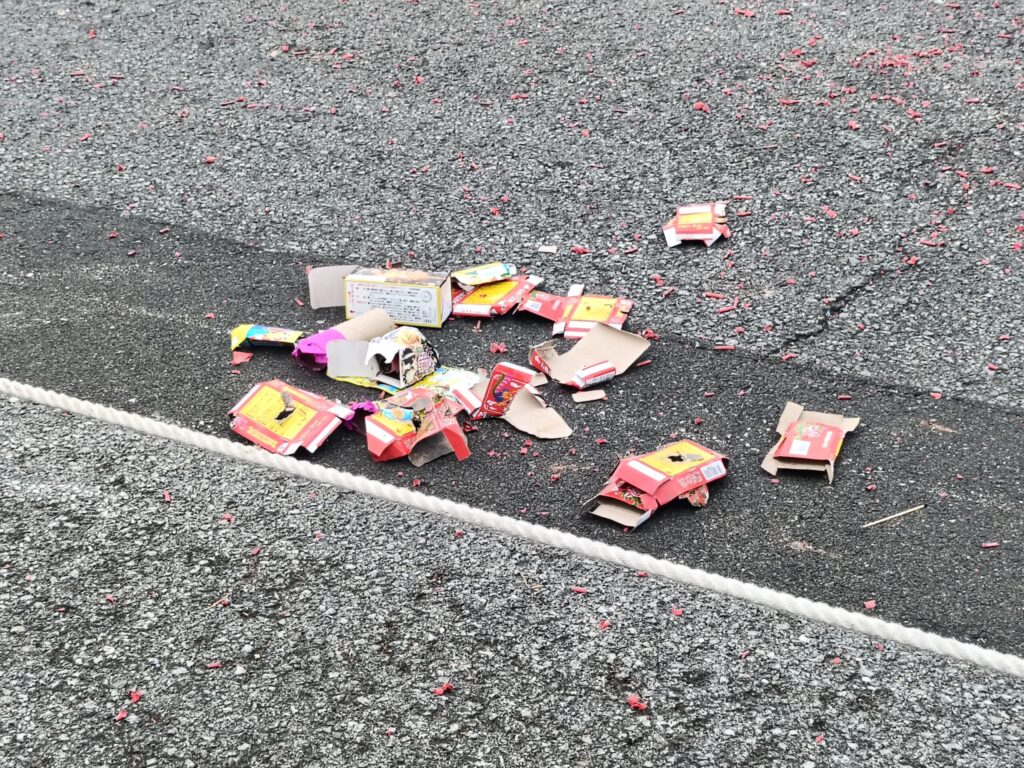 One Night a Year, Firecrackers Take Over the Streets: Nagasaki's Shoro Nagashi Spent firecracker wrappers scattered across the road after Shoro Nagashi