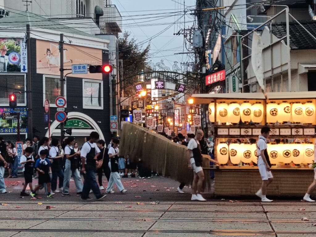 One Night a Year, Firecrackers Take Over the Streets: Nagasaki's Shoro Nagashi A spirit boat passing through the neon-lit Shianbashi intersection