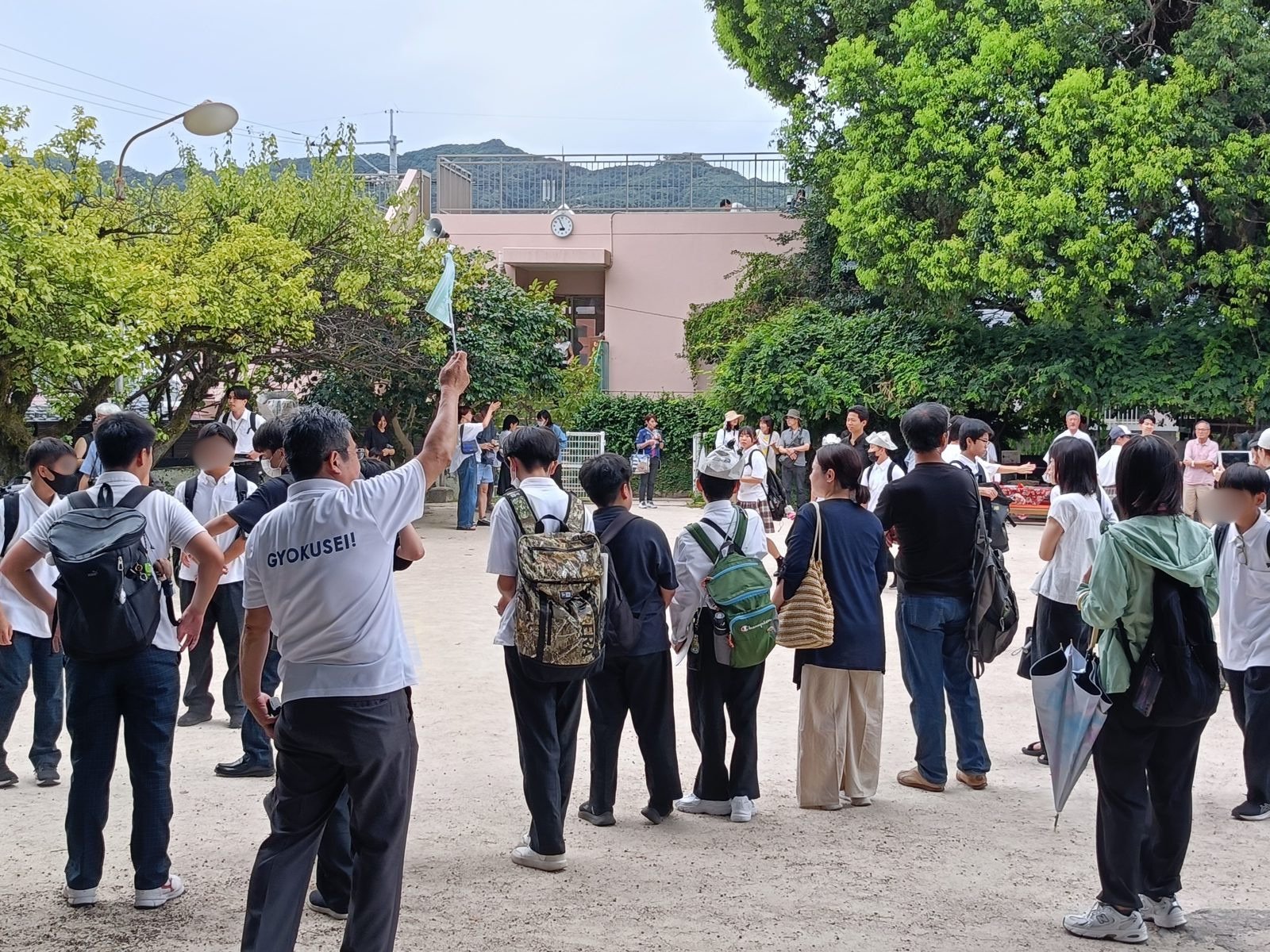 What Happens in Nagasaki on August 9: Inside the Moment of Silence at Sannō Shrine Students and residents gather in the schoolyard ahead of the 11:02 a.m. moment of silence, faces blurred for privacy